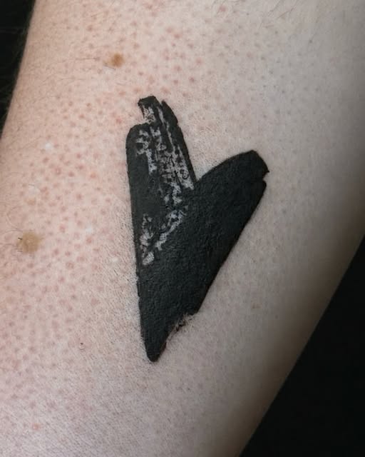Heart tattoo on hand