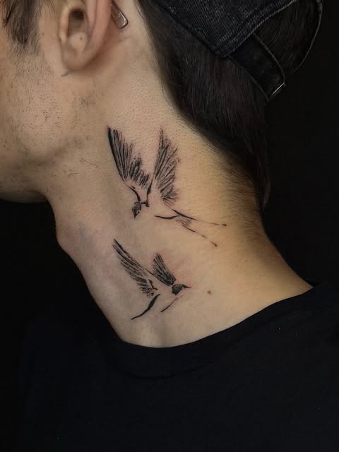 Swallows tattoo on neck