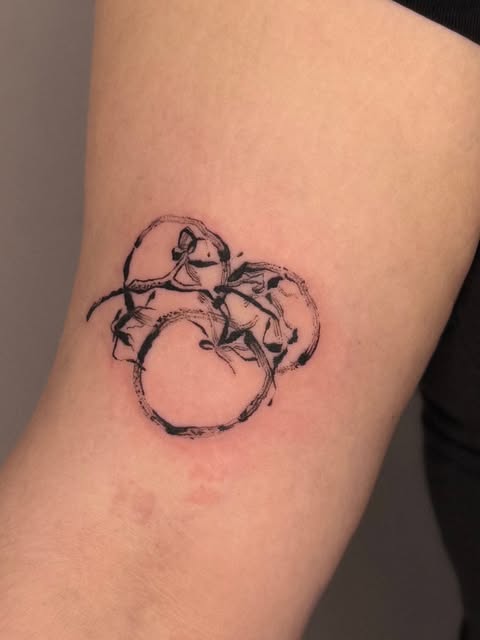 Fruit study tattoo on arm